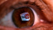 A picture illustration shows a YouTube logo reflected in a person's eye, in central Bosnian town of Zenica, early June 18, 2014.