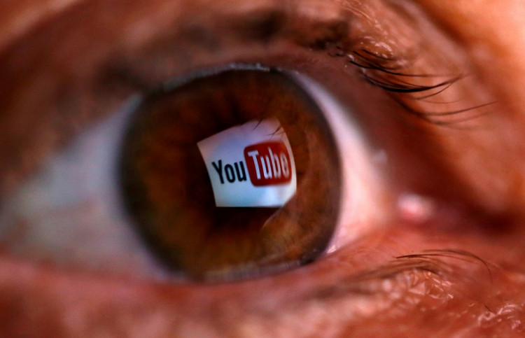 A picture illustration shows a YouTube logo reflected in a person's eye, in central Bosnian town of Zenica, early June 18, 2014.