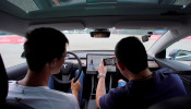 People attend a Tesla performance driving school event at Shanghai International Circuit