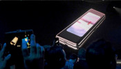 The Samsung Galaxy Fold phone is shown on a screen at Samsung Electronics' Unpacked event in San Francisco, California, U.S., Feb. 20, 2019 