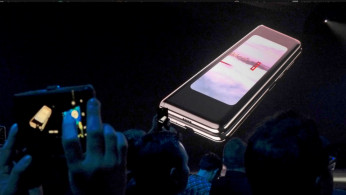 The Samsung Galaxy Fold phone is shown on a screen at Samsung Electronics' Unpacked event in San Francisco, California, U.S., Feb. 20, 2019 