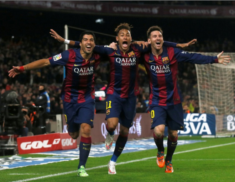 Barcelona's Luis Suarez, Neymar and Lionel Messi celebrate a goal against Atletico Madrid during their Spanish First Division 
