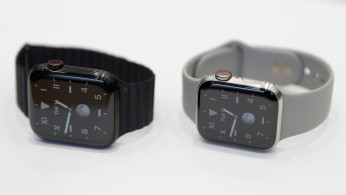 Two titanium Apple Watch Edition smart watches are seen in the demonstration area during an Apple event at their headquarters in Cupertino