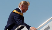 Money is seen in the back pocket of U.S. President Donald Trump as he boards Air Force One at Moffett Federal Airfield in Mountain View